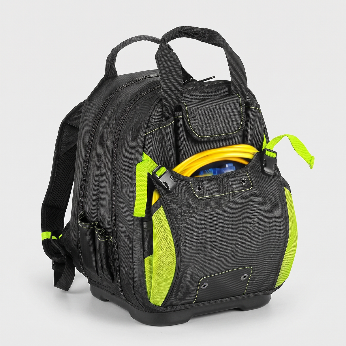 Black heavy-duty tool backpack with hi-vis green trim and moulded base